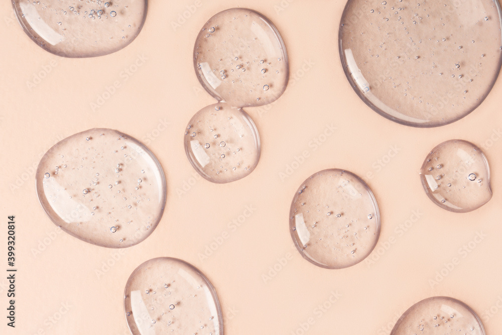 © Anna - Drops and smears of cosmetics. Drops of liquid transparent gel with bubbles on a brown background. © Anna - Drops and smears of cosmetics. Drops of liquid transparent gel with bubbles on a brown background.