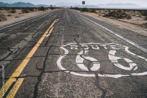 Sign of route 66 on asphalt road