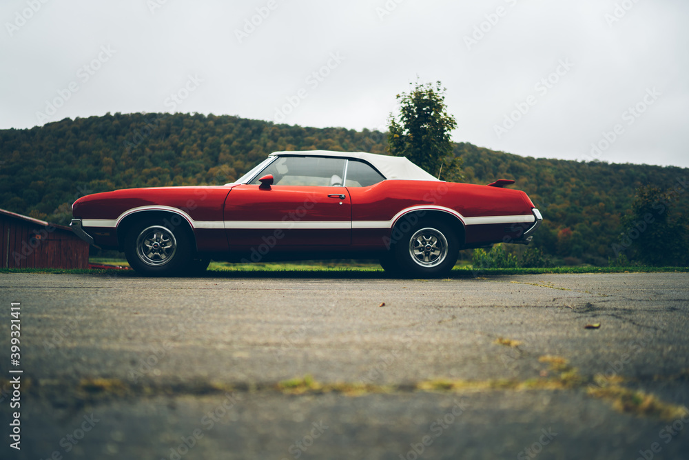 Red vintage American car on street