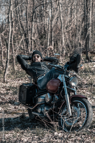 Biker portrait. Photo with a motorcycle © algrigo
