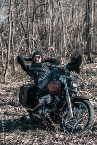 Biker portrait. Photo with a motorcycle