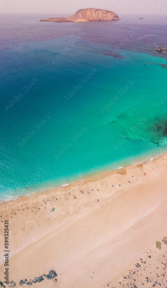 Aerial view of the beach Playa de Las Conchas in the north of La Graciosa, the main archipelago island Chinijo, a mile northwest of Lanzarote. Canary island. Spain. Ocean view and sand beach 