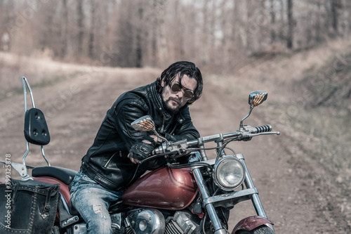 Biker portrait. Photo with a motorcycle