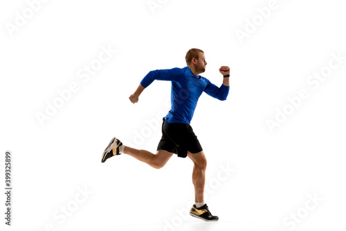 Expression. Caucasian professional jogger, runner training isolated on white studio background. Muscular, sportive man, emotional. Concept of action, motion, youth, healthy lifestyle. Copyspace for ad © master1305