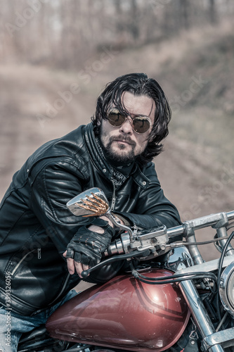 Biker portrait. Photo with a motorcycle