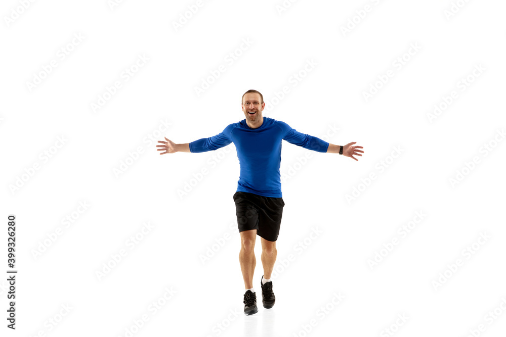 Expression. Caucasian professional jogger, runner training isolated on white studio background. Muscular, sportive man, emotional. Concept of action, motion, youth, healthy lifestyle. Copyspace for ad
