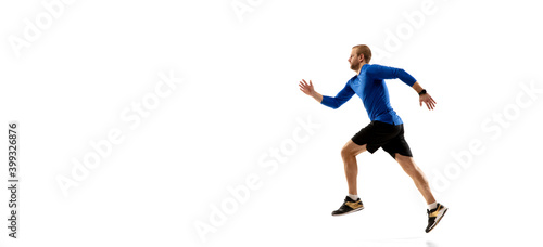 Flyer. Caucasian professional jogger, runner training isolated on white studio background. Muscular, sportive man, emotional. Concept of action, motion, youth, healthy lifestyle. Copyspace for ad.