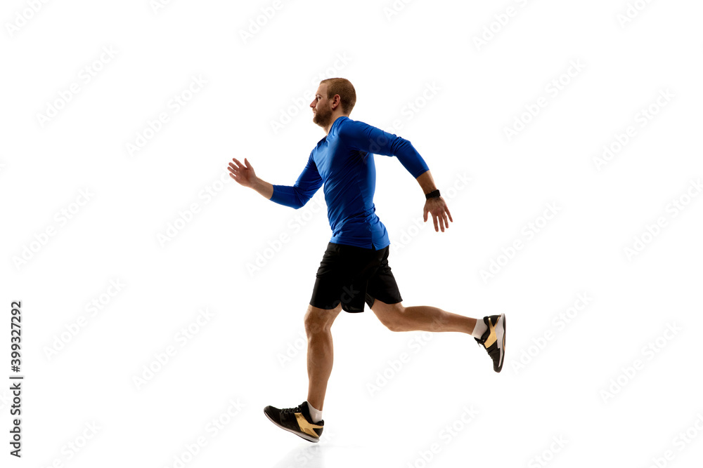 Target. Caucasian professional jogger, runner training isolated on white studio background. Muscular, sportive man, emotional. Concept of action, motion, youth, healthy lifestyle. Copyspace for ad.