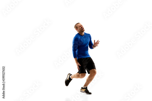 Pain. Caucasian professional jogger, runner training isolated on white studio background. Muscular, sportive man, emotional. Concept of action, motion, youth, healthy lifestyle. Copyspace for ad.