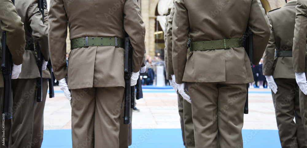 Soldiers lined up in the city square before performing the ceremony - The Army soldiers standing in row they are wearing and wear military uniforms - Concept of patriotism and defense of the nation Soldiers lined up in the city square before performing the ceremony - The Army soldiers standing in row they are wearing and wear military uniforms - Concept of patriotism and defense of the nation