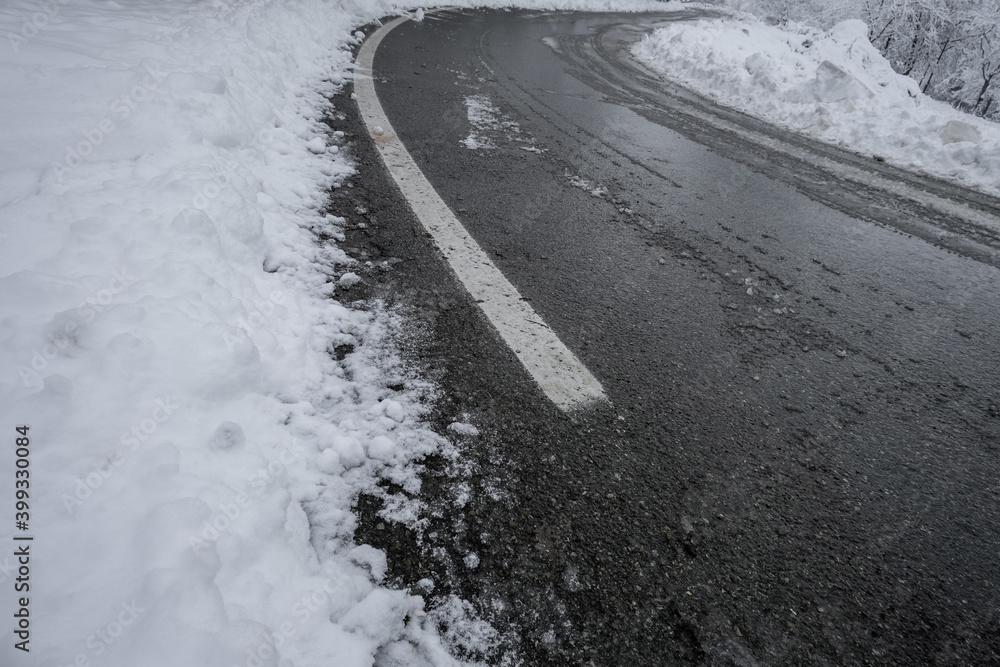 snow-covered curved road close-up. Transportation. Top view