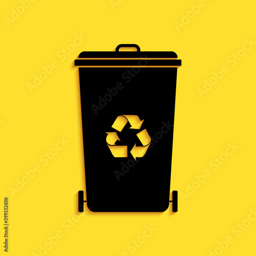 Black Recycle bin with recycle symbol icon isolated on yellow background. Trash can icon. Garbage bin sign. Recycle basket icon. Long shadow style. Vector.