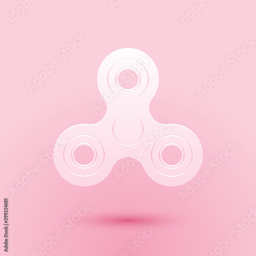 Paper cut Fidget spinner icon isolated on pink background. Stress relieving toy. Trendy hand spinner. Paper art style. Vector.
