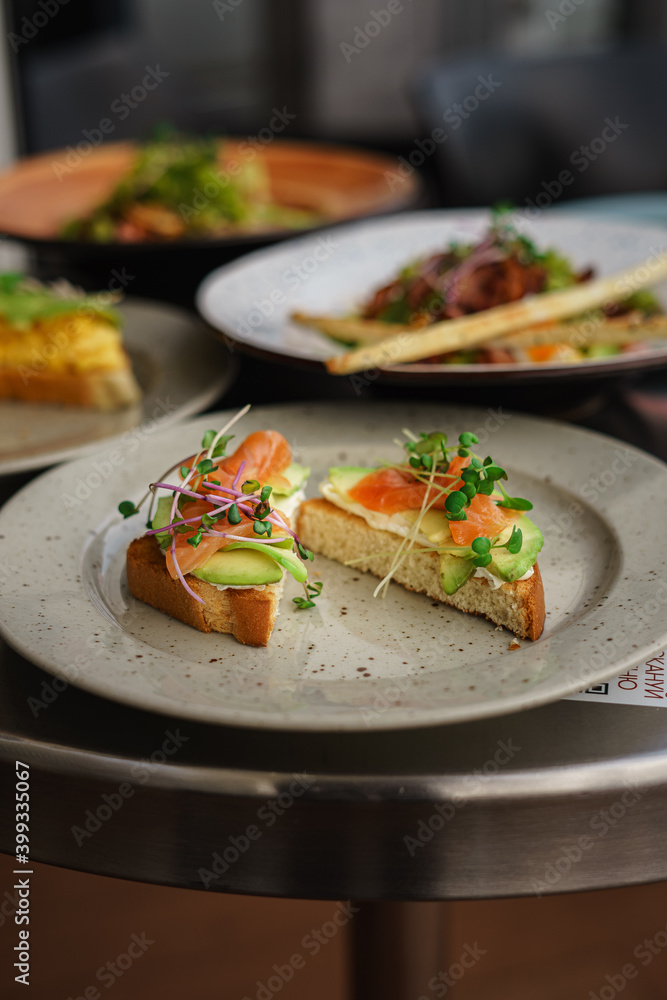 Sandwiches with fish and vegetable meat salad on the table