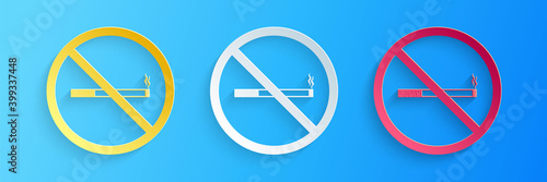 Paper cut No Smoking icon isolated on blue background. Cigarette symbol. Paper art style. Vector.