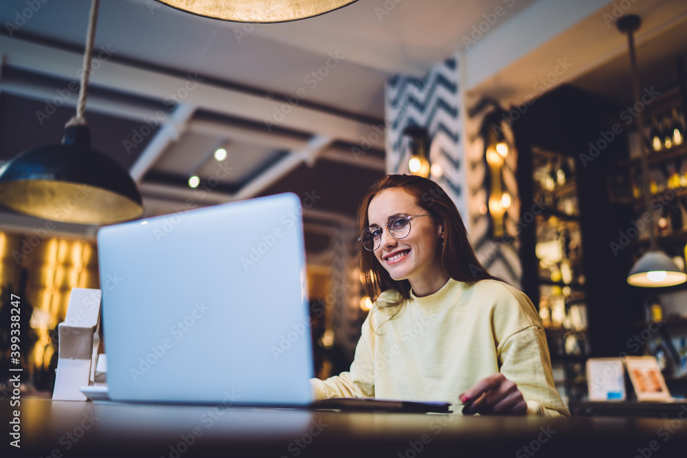 Woman with laptop looking at camera Woman with laptop looking at camera