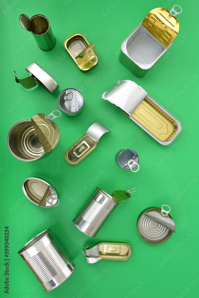 top view of a set of cans on green background. top view of a set of cans on green background.