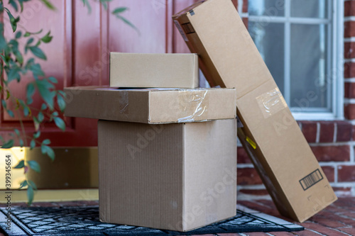 Принти на полотні A stack of online orders delivered and left on front porch of home