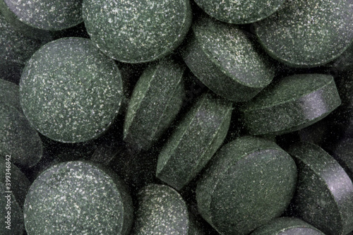 Chlorella Tablets in a Jar Closeup View
