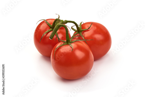 Ripe fresh tomatoes, close-up, isolated on white background