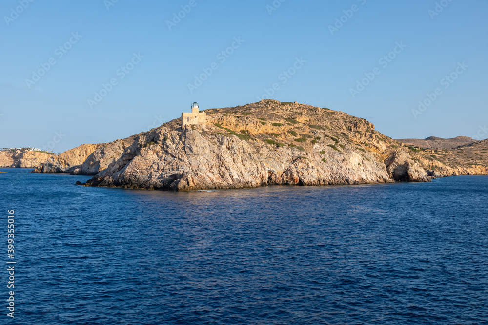 View of the lighthouse on the peninsula, Chora , Ios Island, Greece. View of the lighthouse on the peninsula, Chora , Ios Island, Greece.