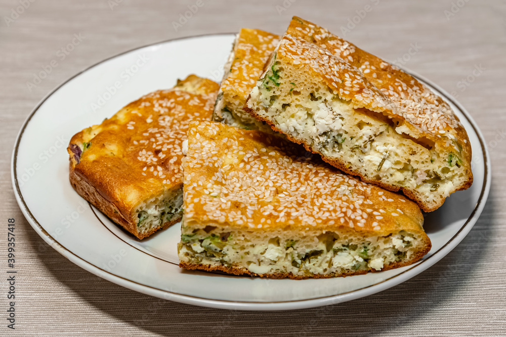 homemade pie with feta cheese and herbs close up homemade pie with feta cheese and herbs close up