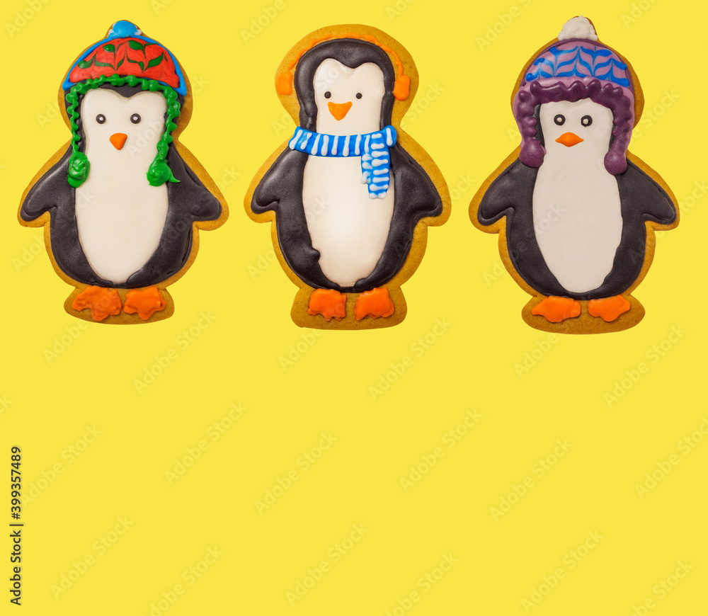 Fototapeta premium Gingerbread cookie of cute penguin on white background isolated. Traditional Christmas food. Christmas and New Year holiday concept..Hand painted. Comfort food. Christmas treat.