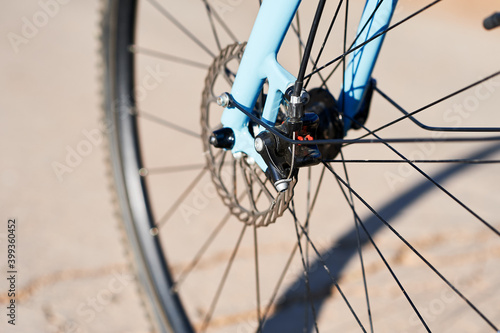 Disc brakes of a racing bike, cable-operated. bicycle fork with wheel.