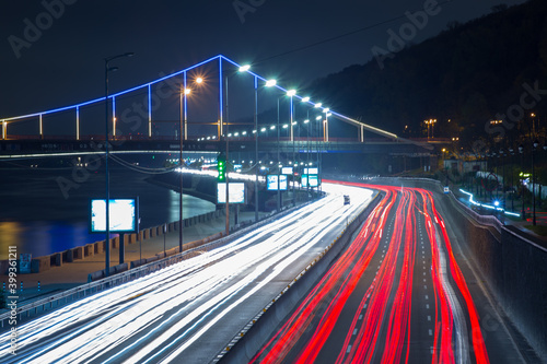 Kyiv, Ukraine 11.11.2020: Long exposure view of the road and bridge with illumination at night kyiv