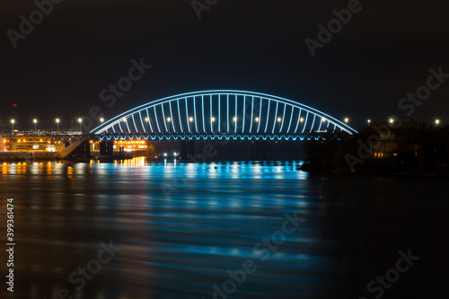 View of the Podilskyi Bridge with bright lights at night