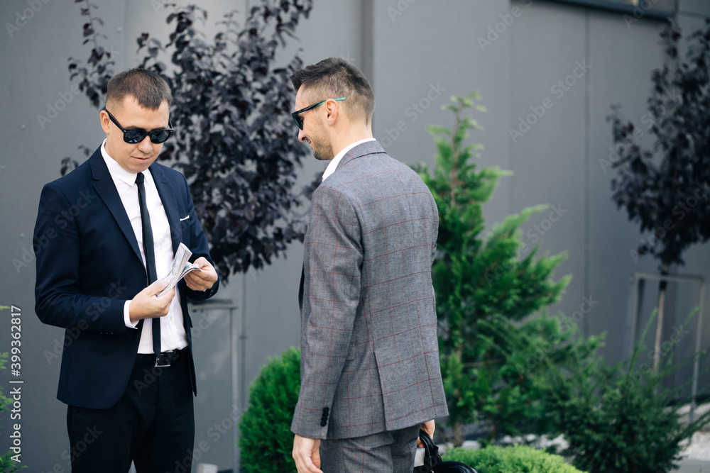 Two unrecognized business partners . Colleagues just made good deal. Business relationship. Successfully made deal Two unrecognized business partners . Colleagues just made good deal. Business relationship. Successfully made deal