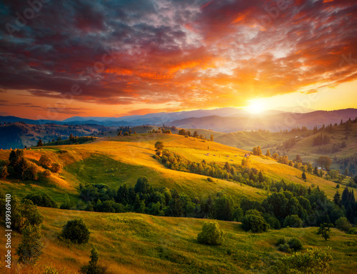Incredible summer sunset in a mountain valley. Location place of Carpathian mountains, Ukraine, Europe. Vibrant photo wallpaper. Breathtaking nature photography. Discover the beauty of earth.