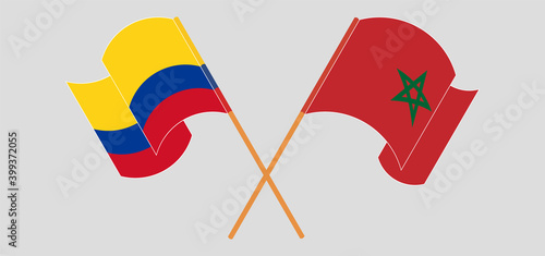 Crossed and waving flags of Colombia and Morocco