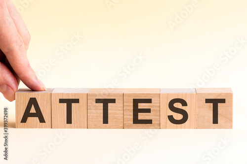 woman made word attest with wood blocks
