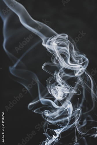 abstract smoke on a black background floats in the air