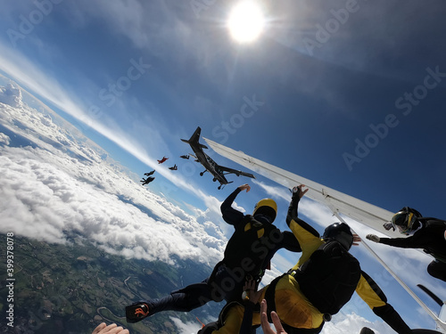 Skydivers jumping out of two airplanes 