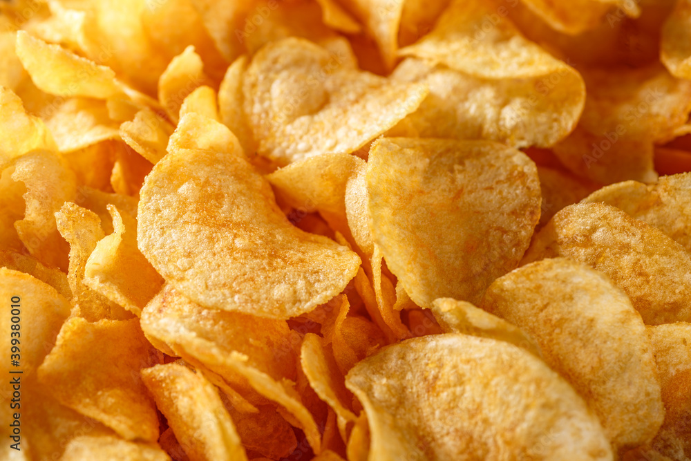 Potato chips or crisps .Potato chips texture background flat overhead view.concept of fast food and snacks. Food background. Potato chips or crisps .Potato chips texture background flat overhead view.concept of fast food and snacks. Food background.