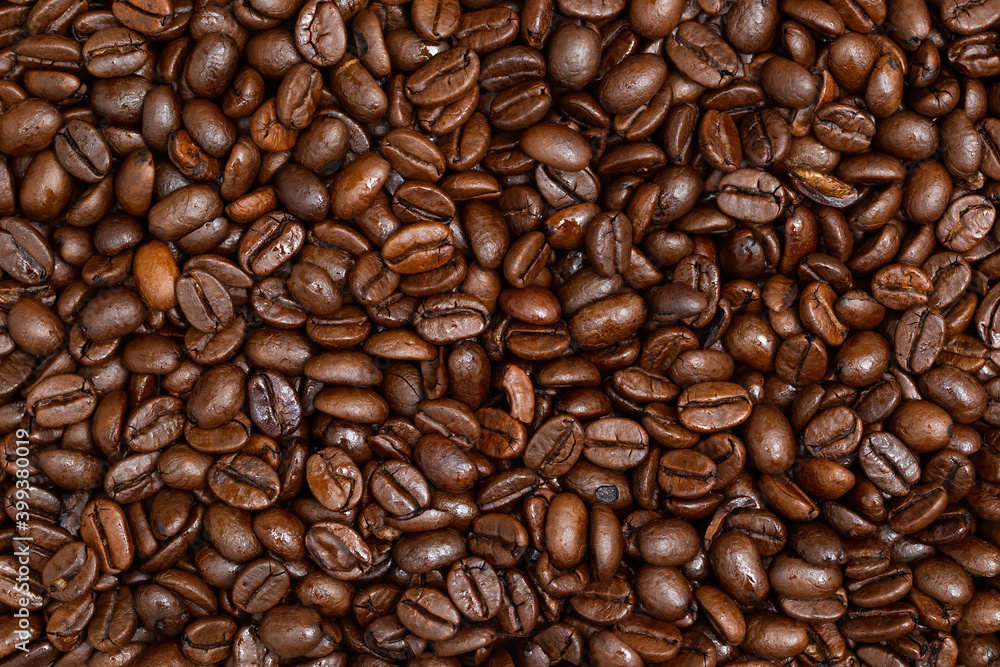 Fullframe shot of roasted coffee beans frome close up. fullframe with background. Brown aromatic seeds on background. Fullframe shot of roasted coffee beans frome close up. fullframe with background. Brown aromatic seeds on background.
