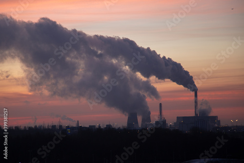 Picturesque sunrise over the power plant. Southern Thermal Power Plant St. Petersburg Russia. Smoke from chimneys.