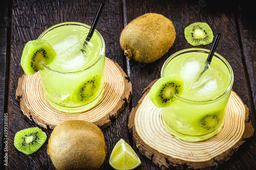 alcoholic drink based on kiwi and Aguardente, cocktail based on distilled drink and fruits, called caipirinha in Brazil and in Mojito vat. photo