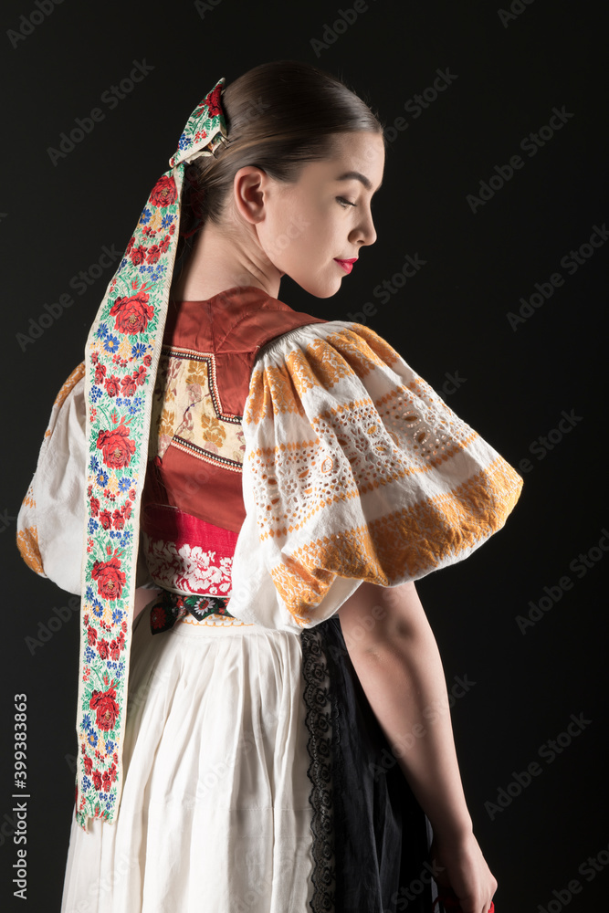 Naklejka premium Slovak folklore. Slovakian folklore girl. Beuatiful young girl in slovak folk dress