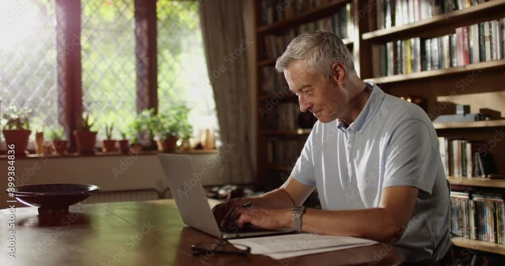 4k, Portrait of a happy and cheerful senior businessman using laptop at home 4k, Portrait of a happy and cheerful senior businessman using laptop at home