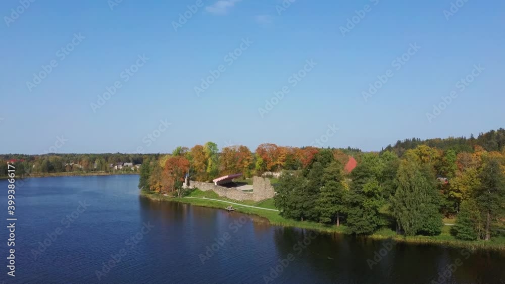 Aluksne Lake Largest Island Pilssala With Park and Ruins of the 14th Century Livonian Order Aluksne Castle in Latvia. Colorfull Autumn Lanscape. Aerial Dron Shot the Coasts and Islands of Aluksne Aluksne Lake Largest Island Pilssala With Park and Ruins of the 14th Century Livonian Order Aluksne Castle in Latvia. Colorfull Autumn Lanscape. Aerial Dron Shot the Coasts and Islands of Aluksne
