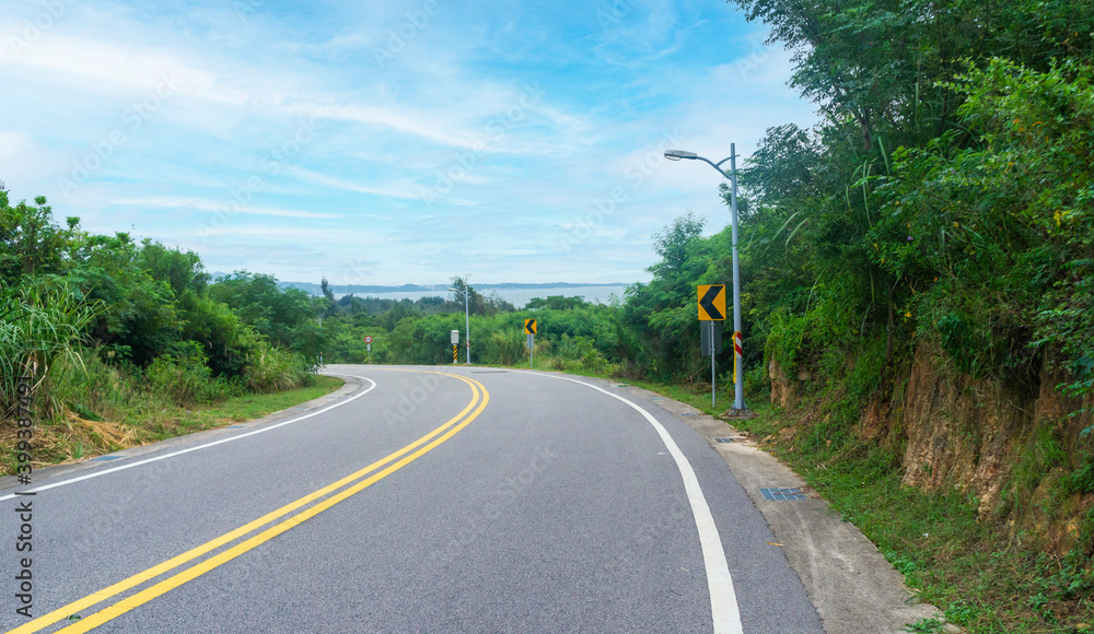 Downslope roadway along seaside in Kinmen Island, Taiwan Downslope roadway along seaside in Kinmen Island, Taiwan