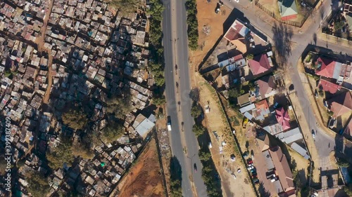 Inequality.  Straight down aerial fly over view of suburban housing along side the Makause informal settlement in Primrose, Germiston on the East Rand, South Africa photo