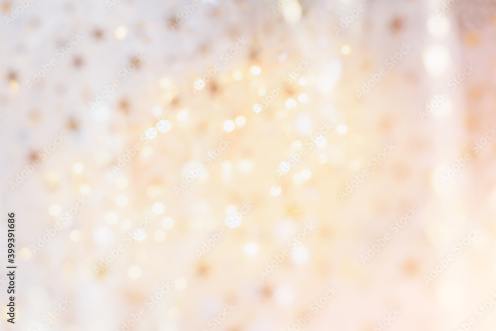 gold glitter and glittering stars on white festive background. Winter holidays background. Christmas and Happy New Year greeting card. Wedding. Birthday. Defocused gold glitter and glittering stars on white festive background. Winter holidays background. Christmas and Happy New Year greeting card. Wedding. Birthday. Defocused