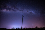 Electrical post and the milky way behind it.