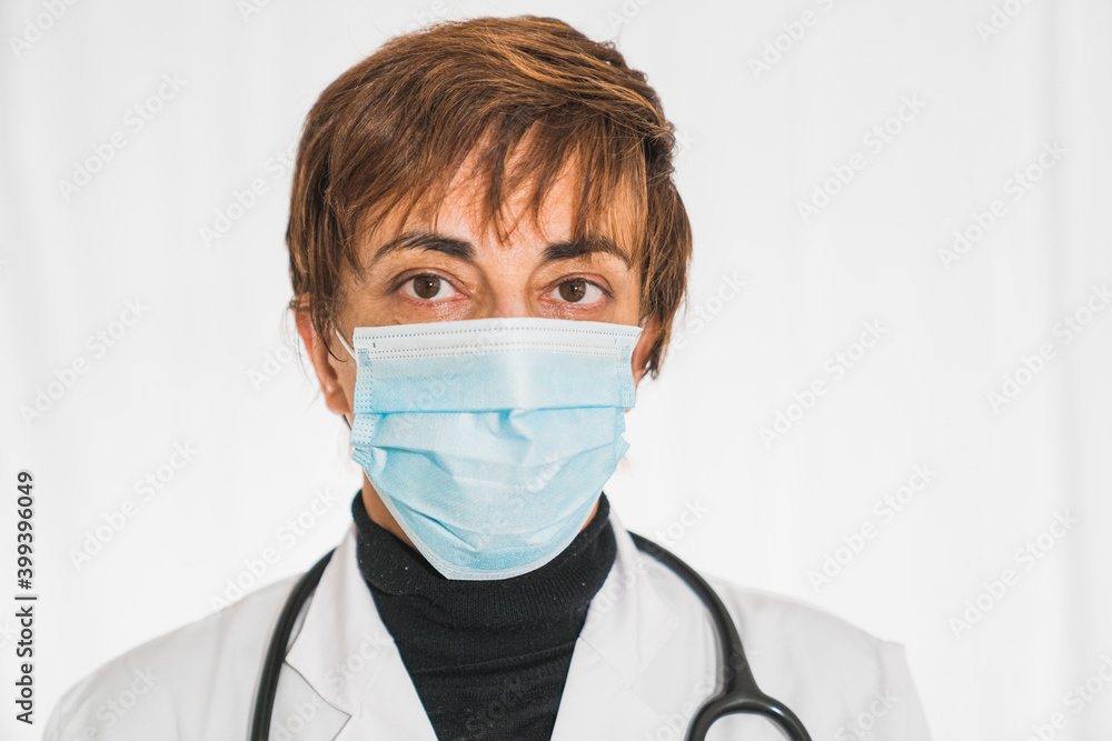 Doctor with face mask looking at camera, corona virus concept. Doctor or physician in white dress uniform and stethoscope at the hospital or clinic Medical Technology, Health and Medical Concept. Doctor with face mask looking at camera, corona virus concept. Doctor or physician in white dress uniform and stethoscope at the hospital or clinic Medical Technology, Health and Medical Concept.