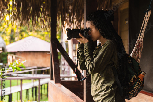 Young girl taking a picture with a camera