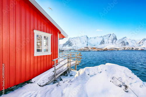Traditional Norwegian red wooden houses on the shore of  Reinefjorden on Toppoya island © pilat666